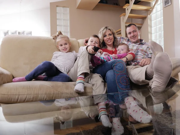 Happy family watching TV at home — Stock Photo, Image