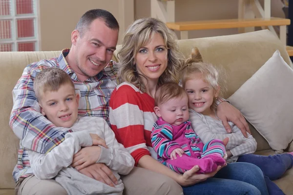 Happy young family at home — Stock Photo, Image