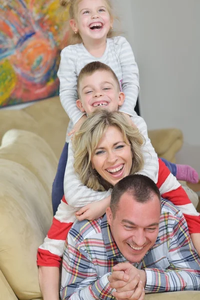 Happy young family at home — Stock Photo, Image