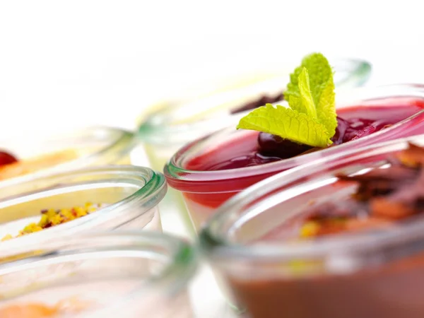 Tasty desserts in glass cups — Stock Photo, Image