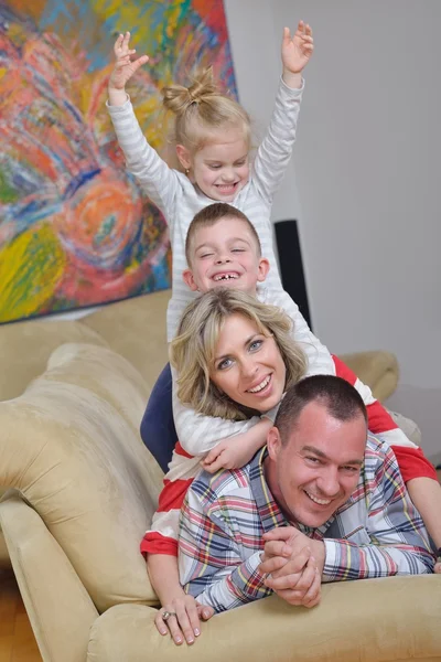 Happy young family at home — Stock Photo, Image