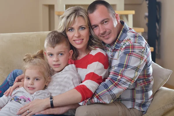 Happy young family at home — Stock Photo, Image