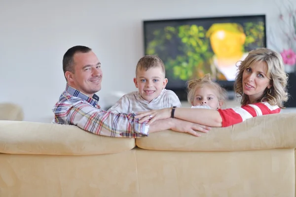 Happy young family at home — Stock Photo, Image