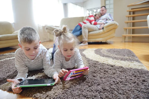 Happy young family at home — Stock Photo, Image