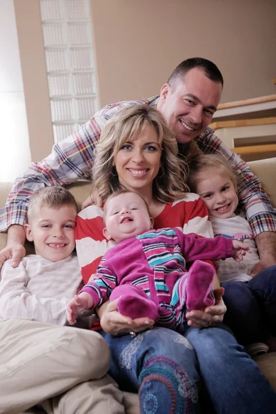 Happy young family at home — Stock Photo, Image