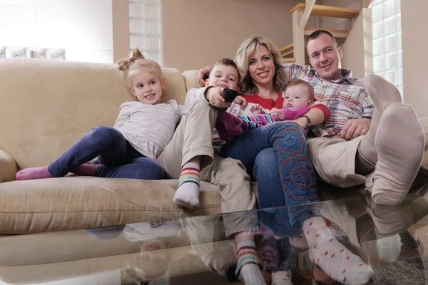 Happy young family at home — Stock Photo, Image