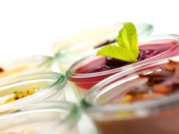 Tasty desserts in glass cups — Stock Photo, Image