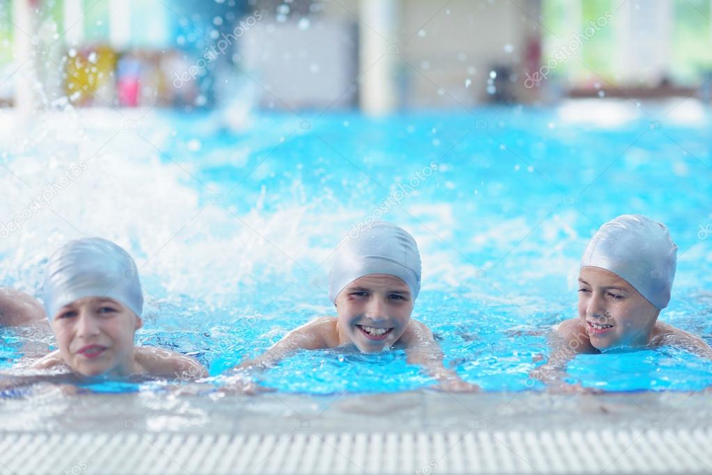 Happy children at swimming pool