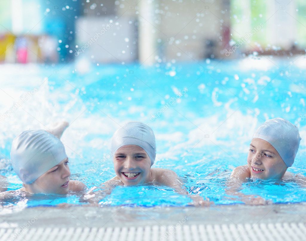 Happy children at swimming pool