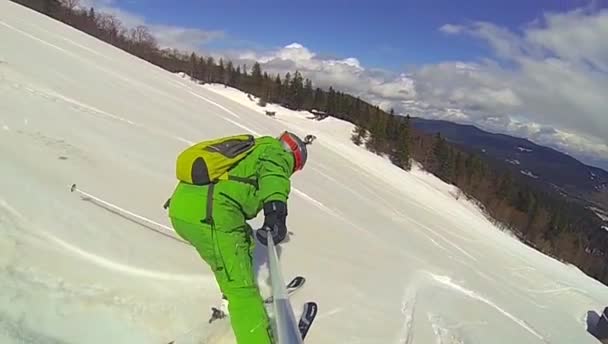 Ski sport, man going downhill with camera — Stock Video