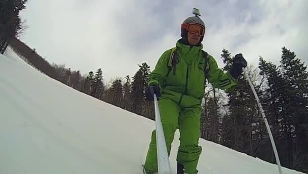 Ski sport, man going downhill with camera — Stock Video