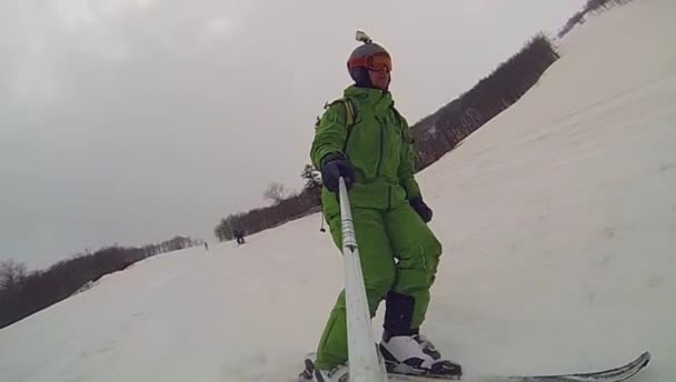 Ski sport, man going downhill with camera — Stock Video