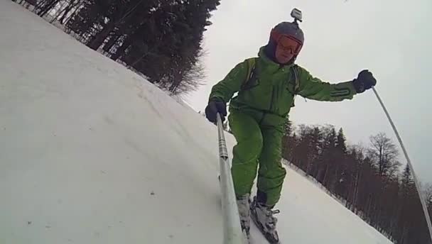 Ski sport, man going downhill with camera — Stock Video