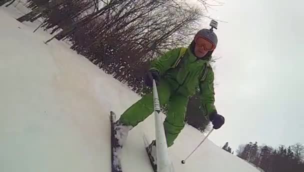 Ski sport, man going downhill with camera — Stock Video