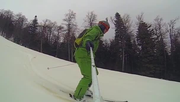 Ski sport, man going downhill with camera — Stock Video