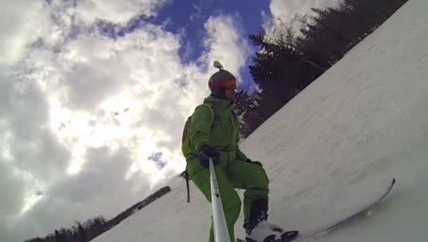 Ski sport, man going downhill with camera — Stock Video