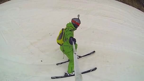 Ski sport, man going downhill with camera — Stock Video