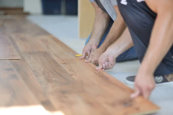 Men Installing laminate floor — Stock Photo, Image