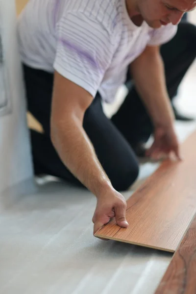 Men Installing laminate flooring — Stock Photo, Image