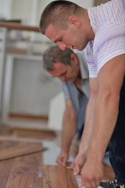 Men Installing laminate flooring — Stock Photo, Image