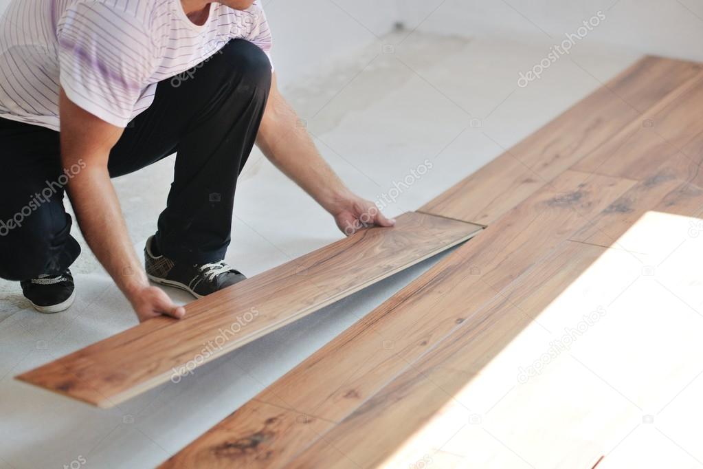 Man Installing laminate floor