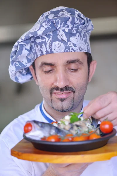 Chef serving fish meal — Stock Photo, Image