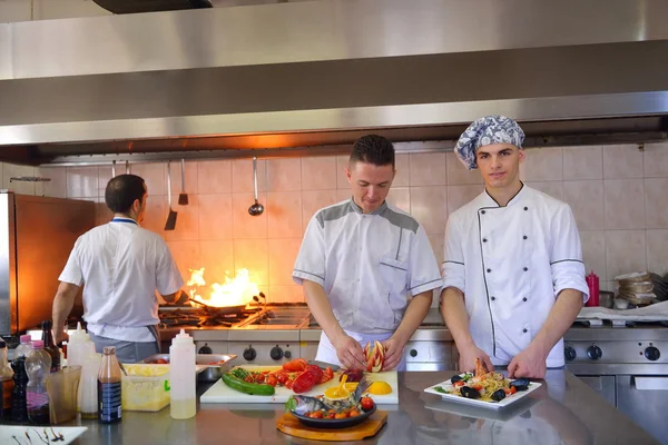 Group of handsome chefs dressed in white uniform — Stock Photo, Image