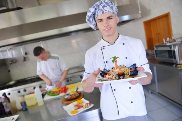 Chef decorating pasta salad — Stock Photo, Image