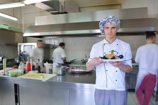 Group of handsome chefs dressed in white uniform — Stock Photo, Image