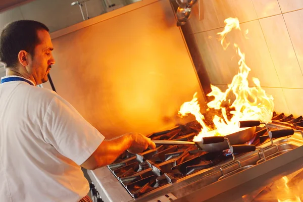 Chef cooking at kitchen — Stock Photo, Image