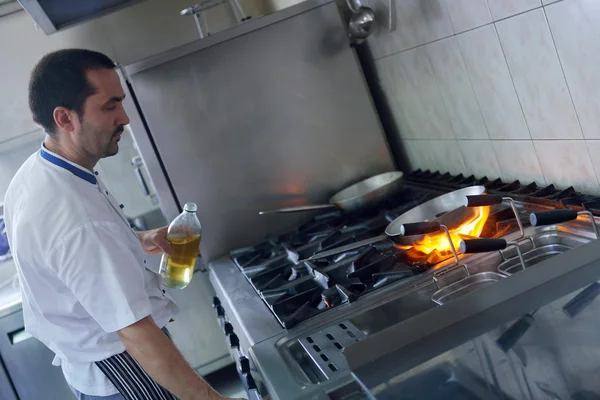 Chef cooking at kitchen — Stock Photo, Image