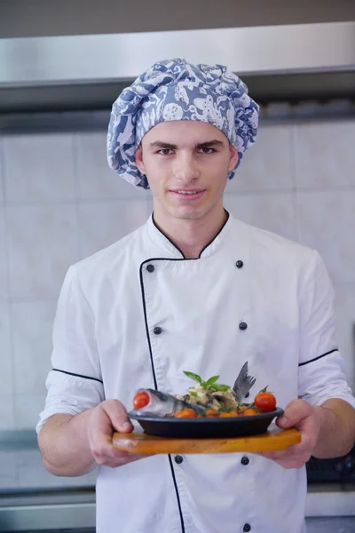 Handsome chef dressed in white uniform — Stock Photo, Image