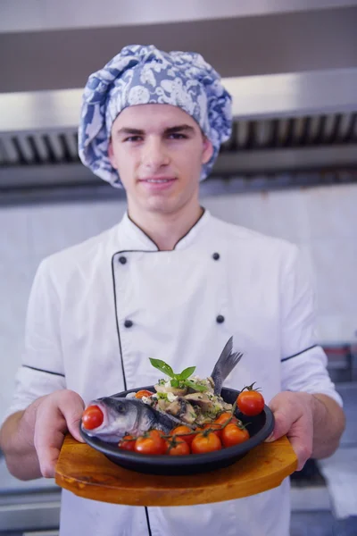 Handsome chef dressed in white uniform — Stock Photo, Image
