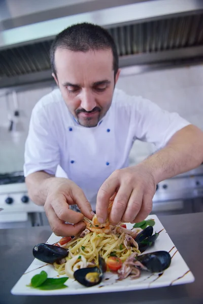 Chef decorating pasta salad — Stock Photo, Image