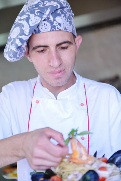 Chef with seafood pasta salad — Stock Photo, Image