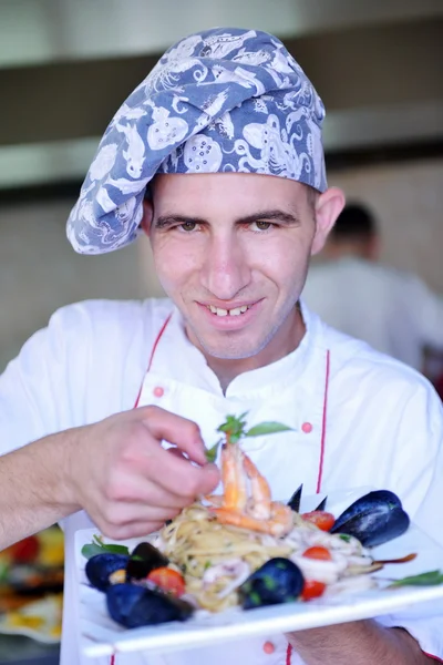 Chef with seafood pasta salad — Stock Photo, Image