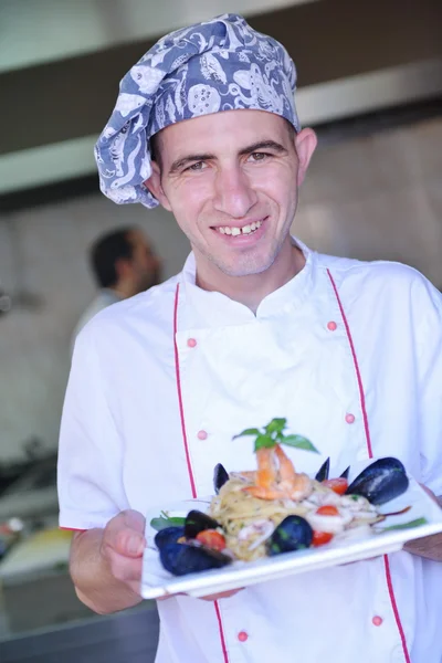 Chef with seafood pasta salad — Stock Photo, Image