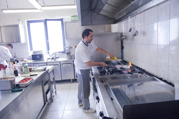 Chef cooking at kitchen — Stock Photo, Image