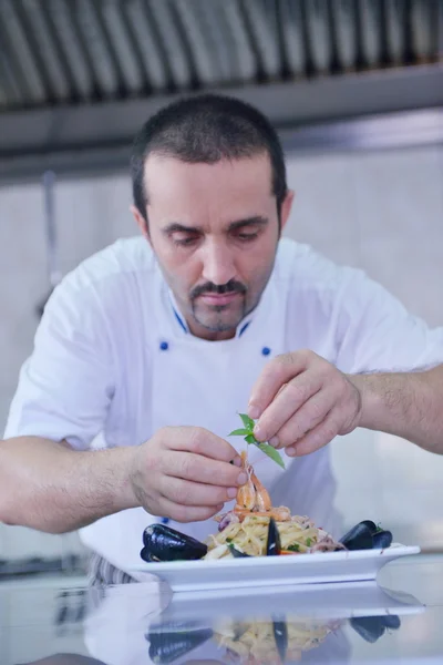 Chef decorating pasta salad — Stock Photo, Image