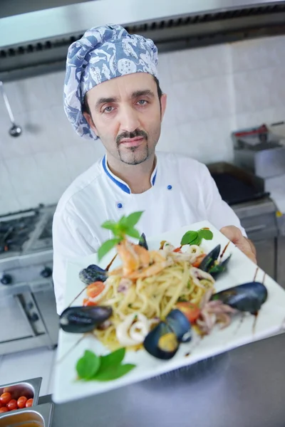 Chef decorating pasta salad — Stock Photo, Image