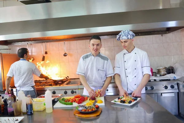 Group of handsome chefs dressed in white uniform — Stock Photo, Image