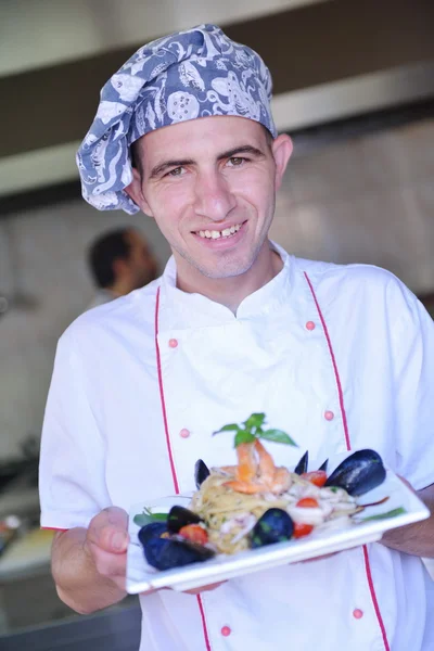 Handsome Chef Dressed White Uniform Seafood Pasta Salad Modern Kitchen — Stock Photo, Image