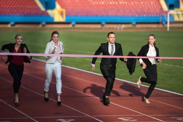 Business people running on racing track — Stock Photo, Image