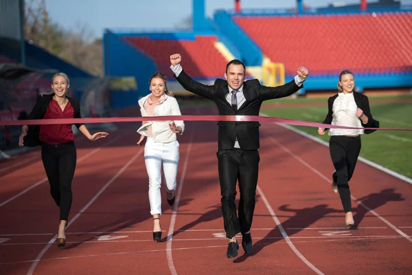 Business people running on racing track — Stock Photo, Image