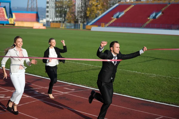 Business people running on racing track — Stock Photo, Image