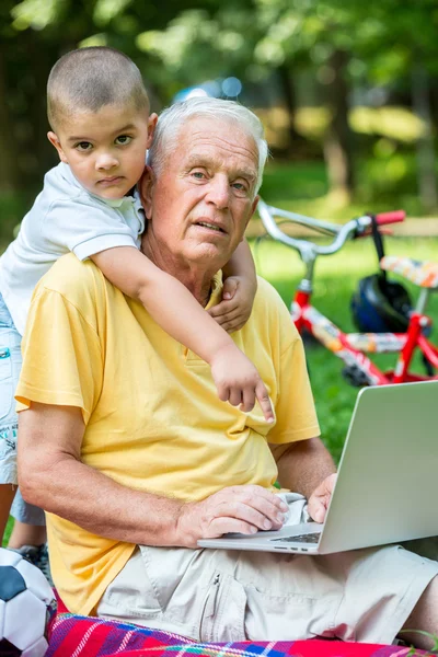 Happy Elderly Senior Grandfather Child Park Using Laptop Computer — Stock Photo, Image
