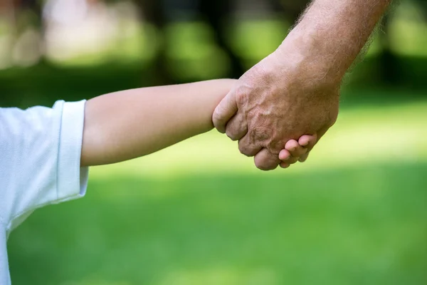 Grandfather and child in park — Stock Photo, Image