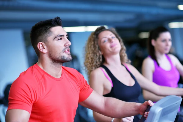 People running on treadmills — Stock Photo, Image