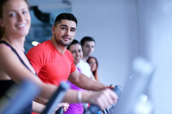 Group of people running on treadmills — Stock Photo, Image