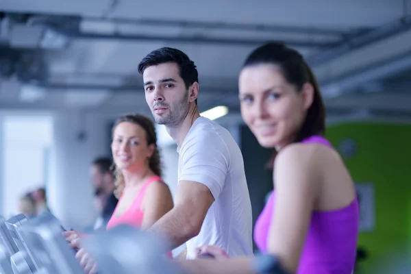 Group of people running on treadmills — Stock Photo, Image